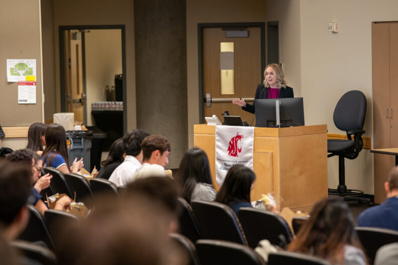 Keynote speaker at a podium. 