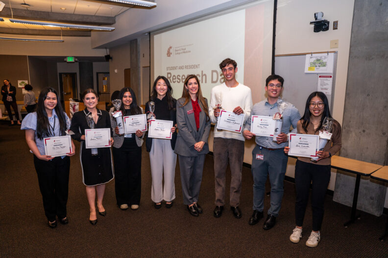 Award recipients pose with certificates at Student and Resident Research Day at WSU Spokane.
