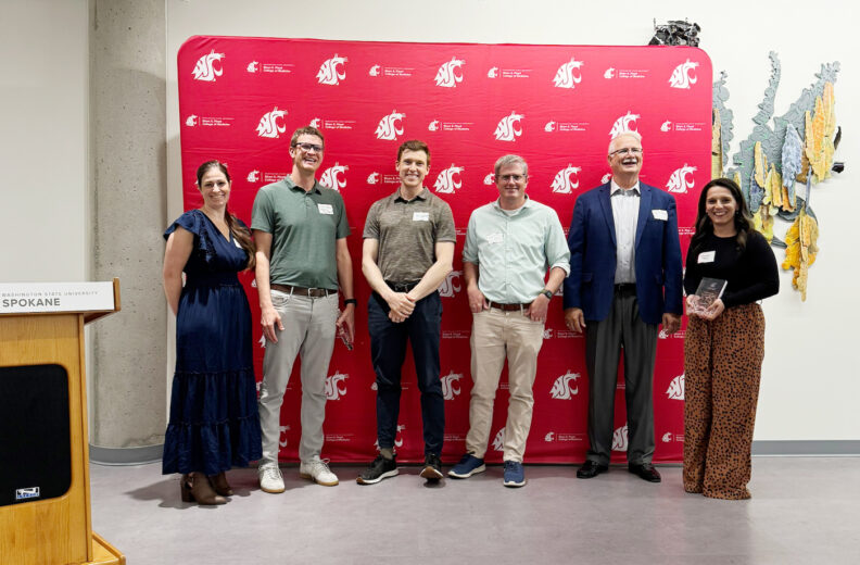 Six people smiling.