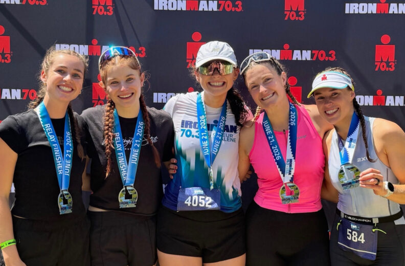 5 WSU Ironman participants holding their medal.