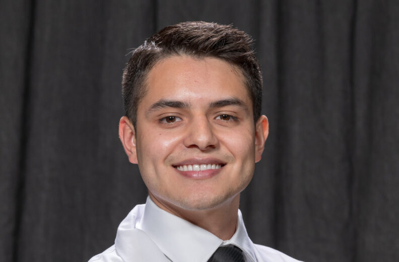 A man smiling at a camera.