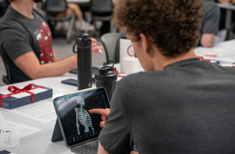 A student on an ipad.