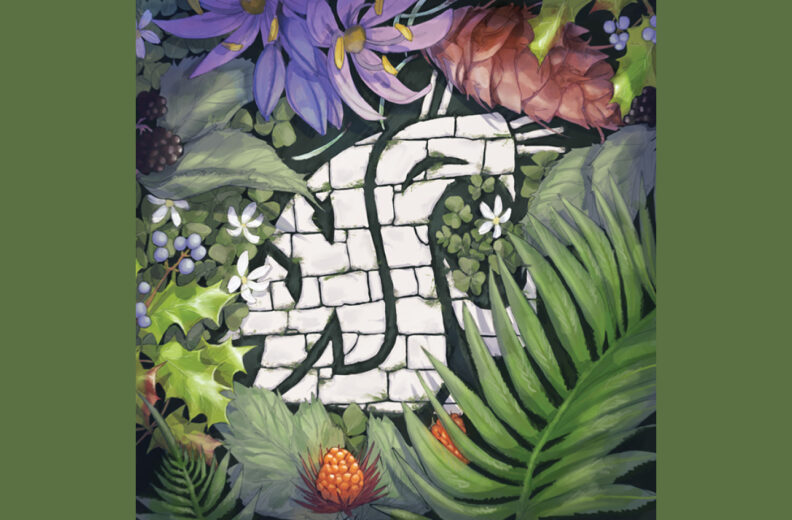 WSU Cougar logo in stone surrounded by colorful foliage.