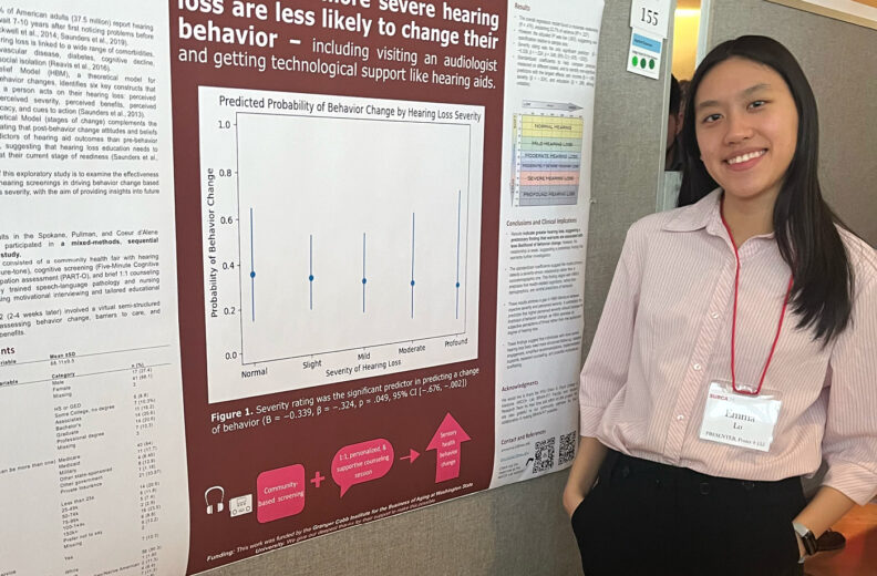 Emma Lo next to her poster at the Showcase for Undergraduate Research and Creative Activities.