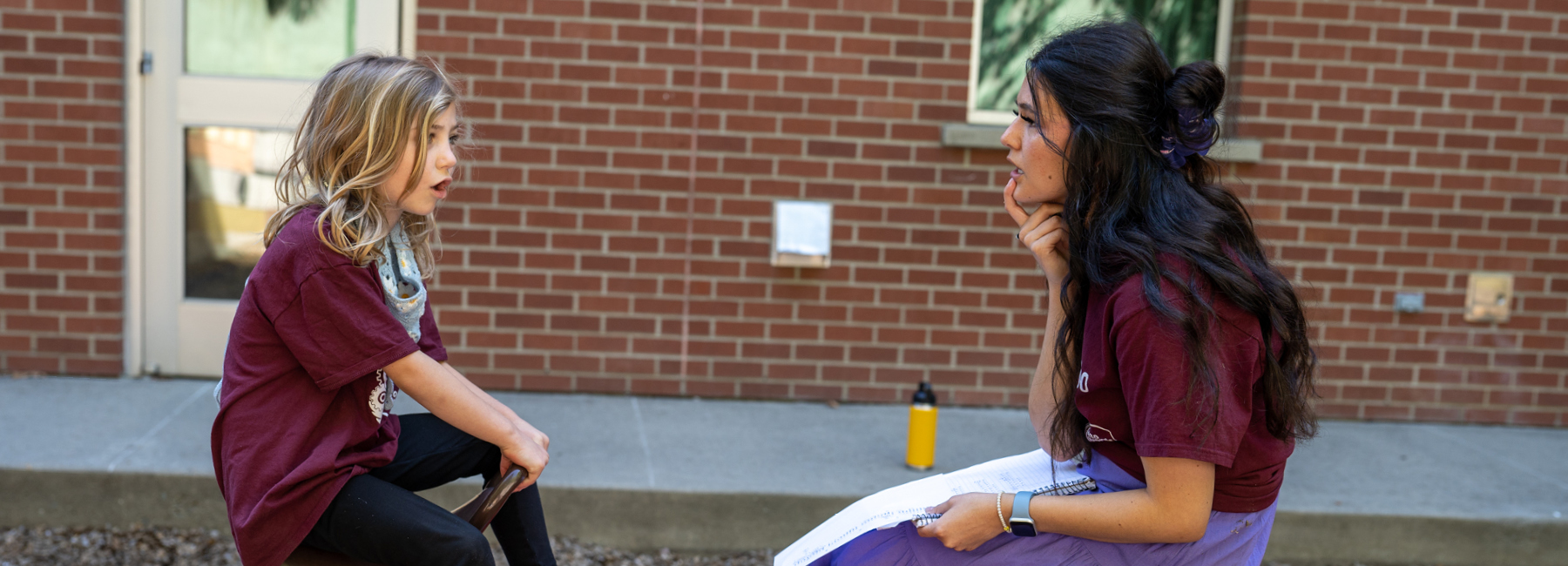 Speech and Hearing Student working with child at Camp Candoo