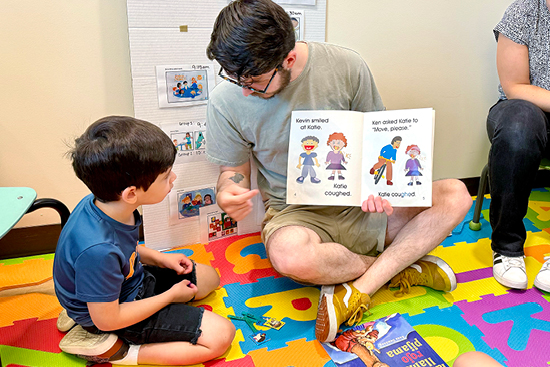 Child reading bilingual book