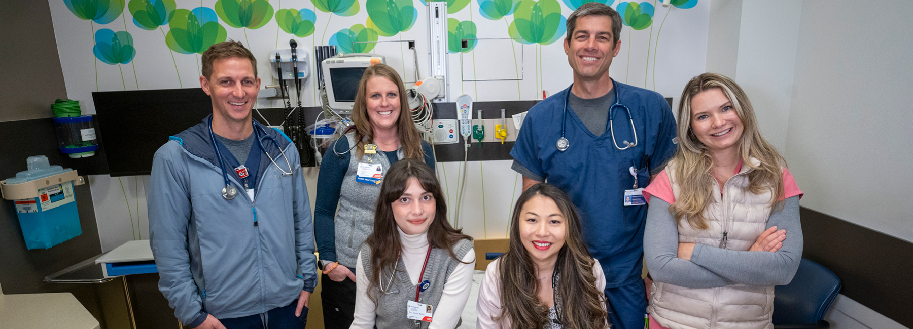 Residents and doctors in exam room