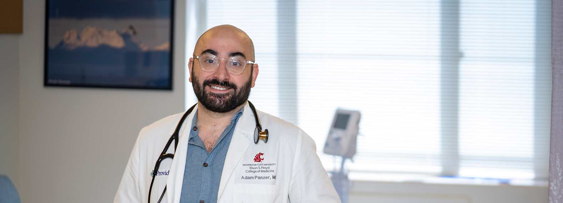 Smiling resident in a exam room.