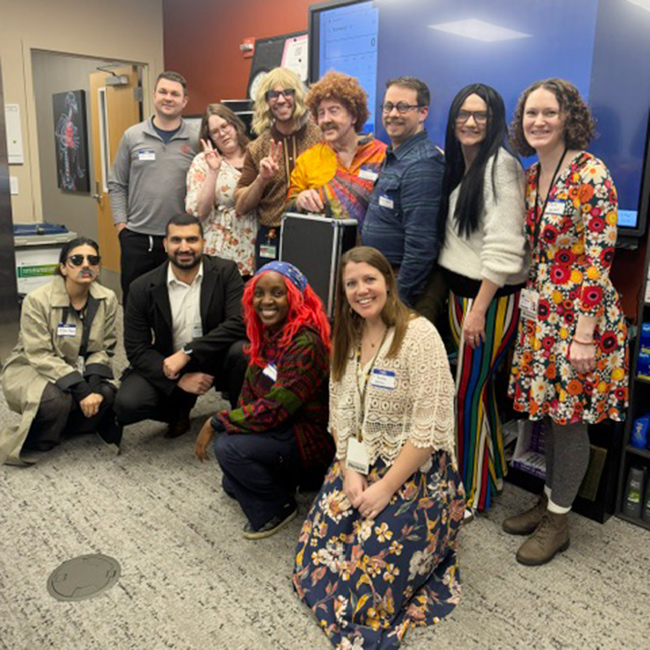 Residents and team dresses in costumes for halloween.