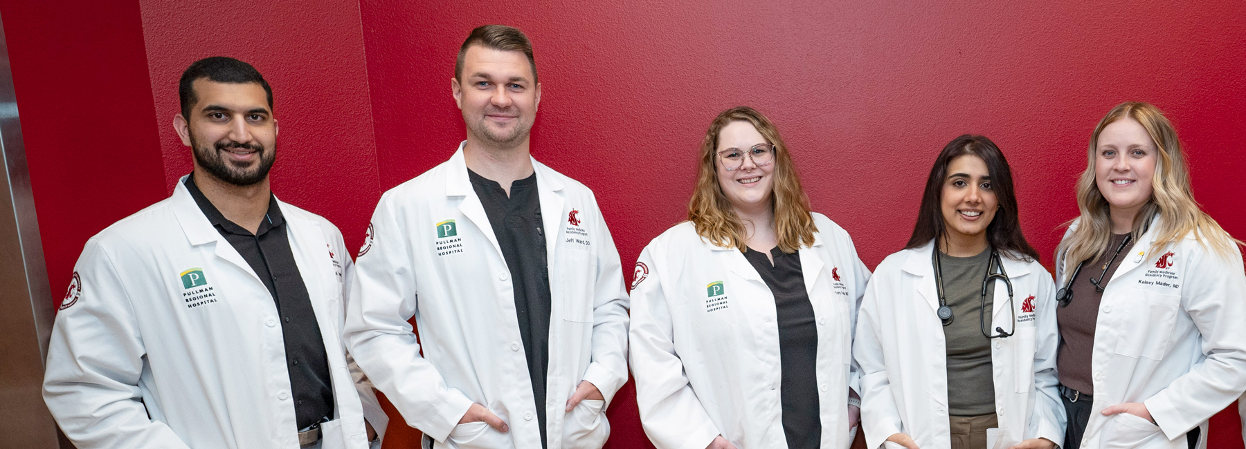 5 family medicine residents smiling.