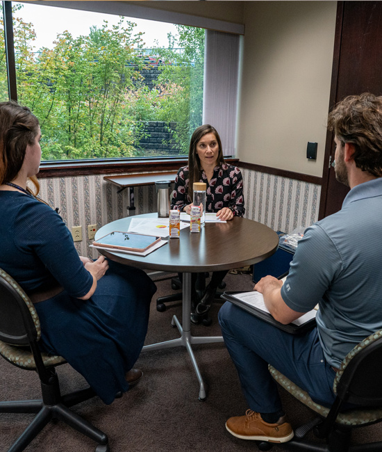 Students and Instructor sitting at a table