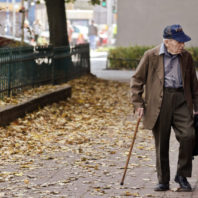 A centenarian is walking outside