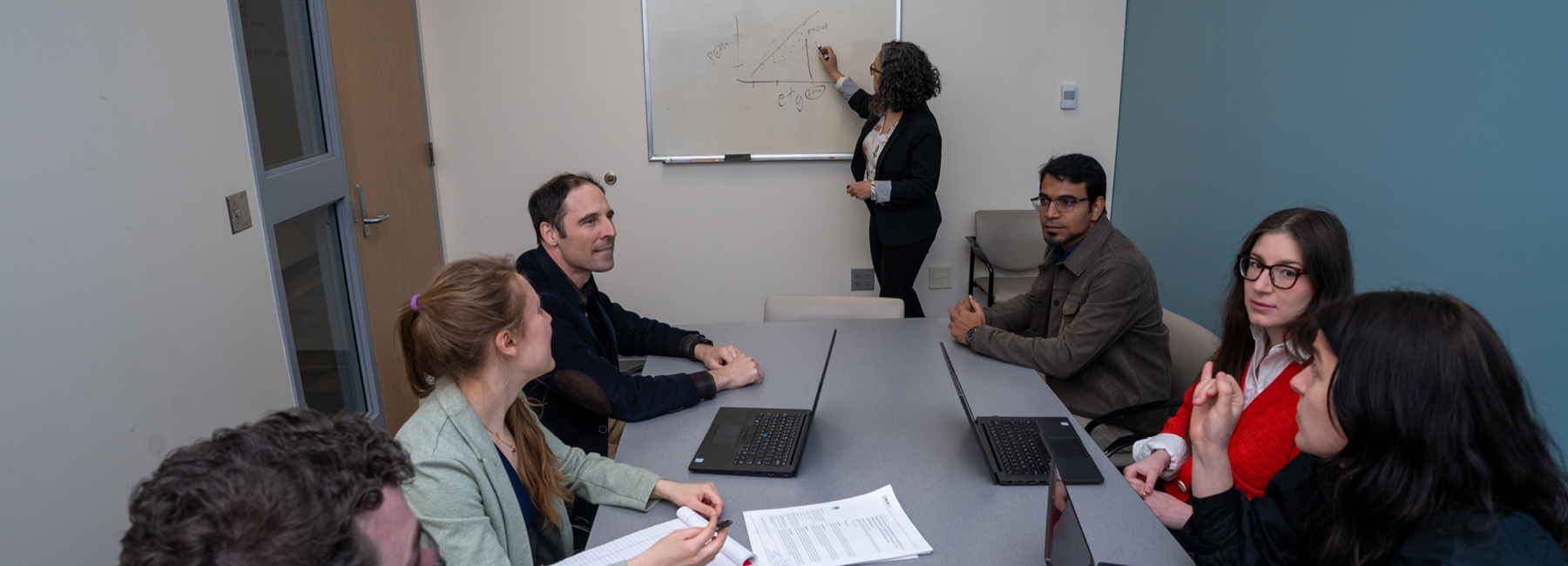 PRISM staff taking in conference room