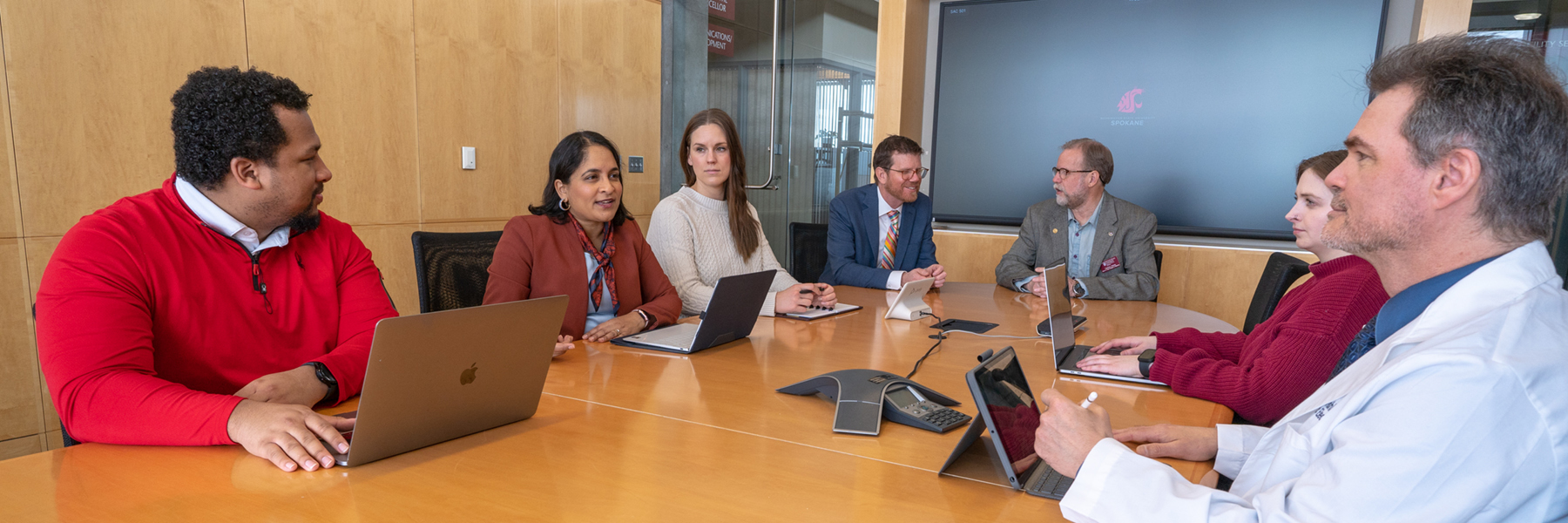 Faculty and staff sitting in conference room