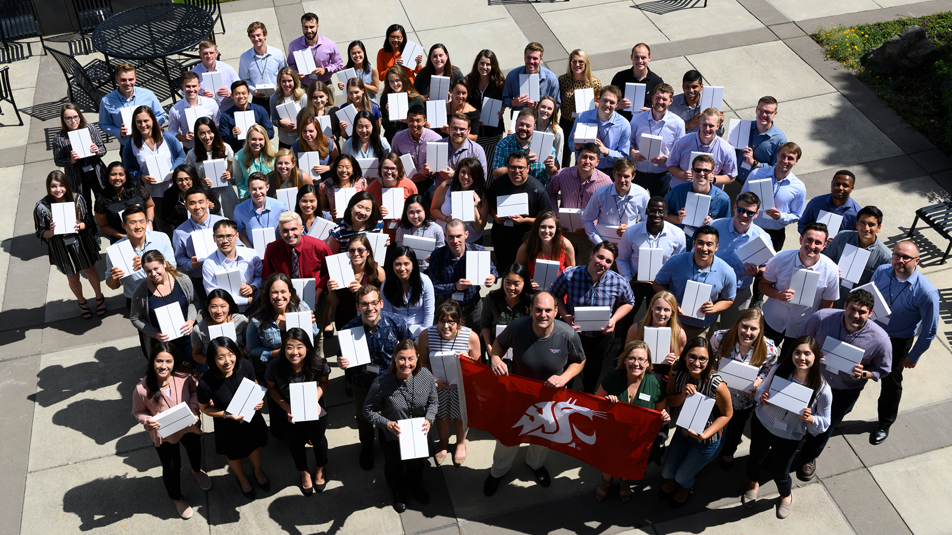 Group of Medical students holding up their iPad boxes.
