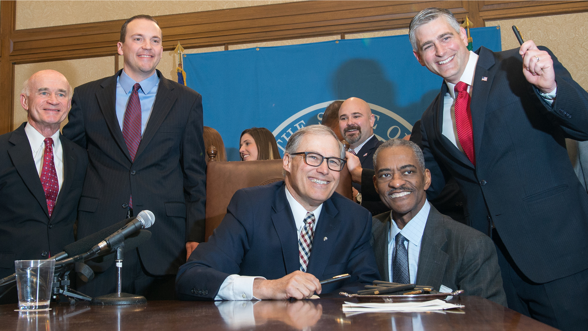 Gov. Jay Inslee Signs WSU Medical School at Legislation along side Elson S. Floyd.