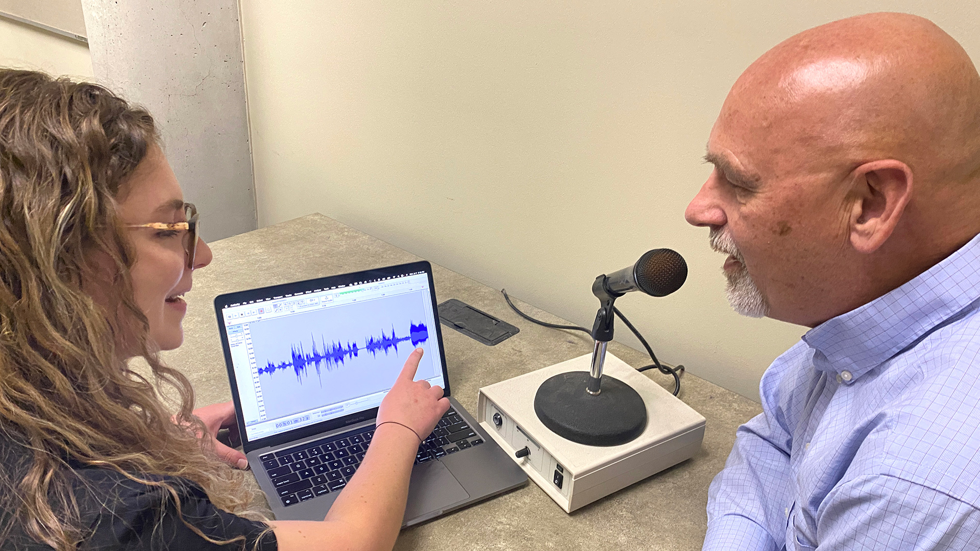 Graduate student giving a speech test with a patient.