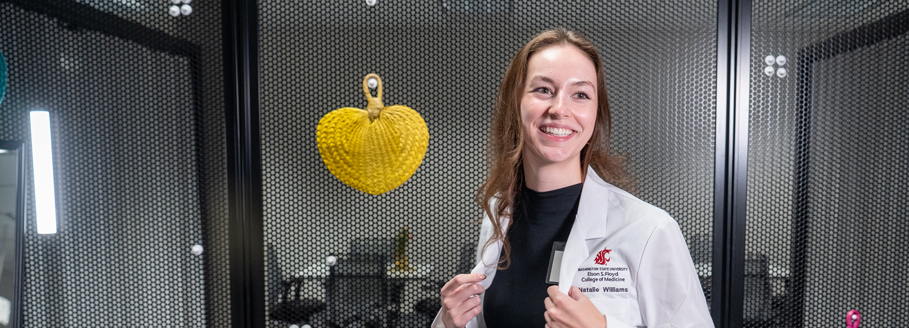 MD student wearing white coat.