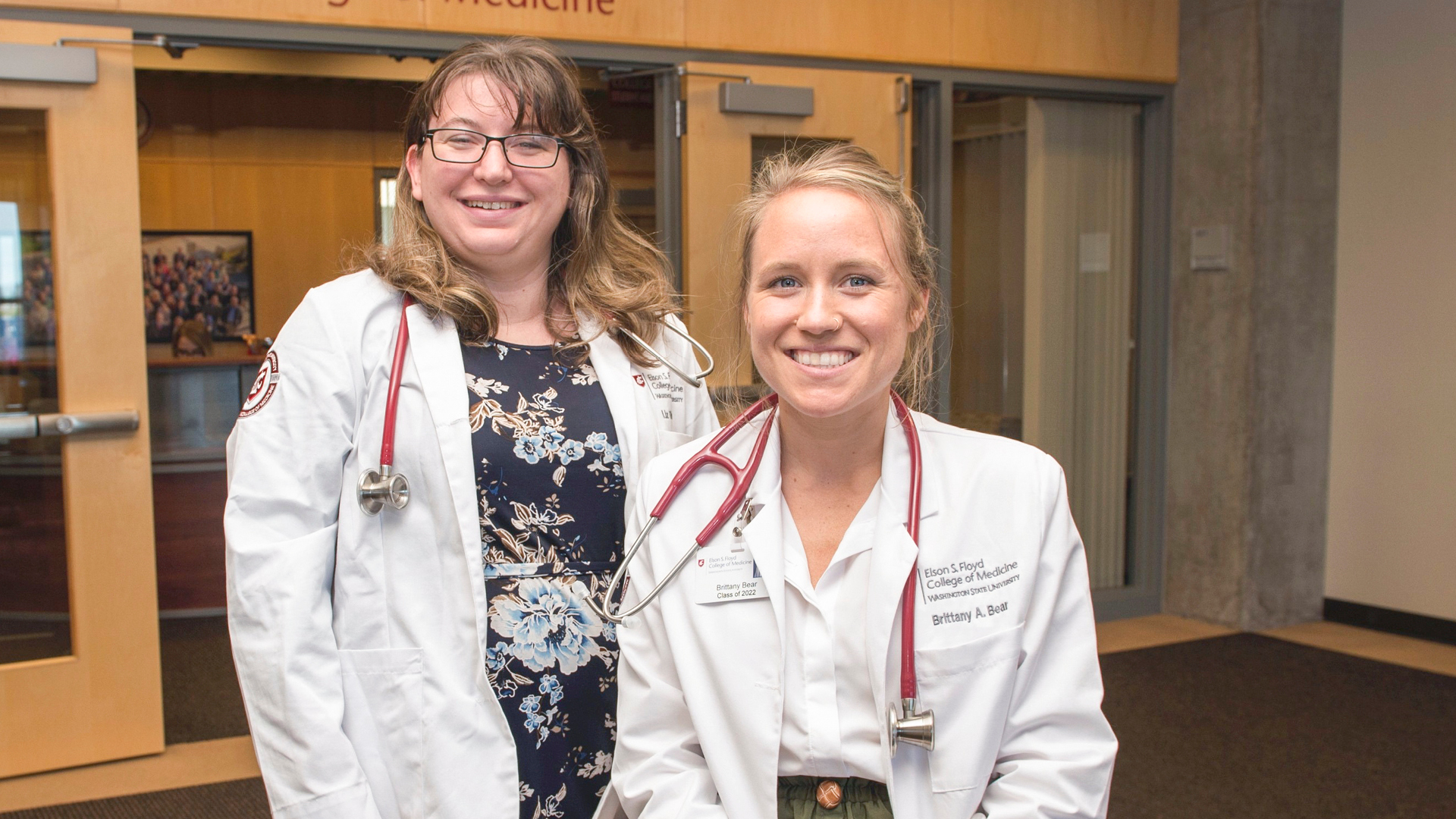 Two MD students smiling. 
