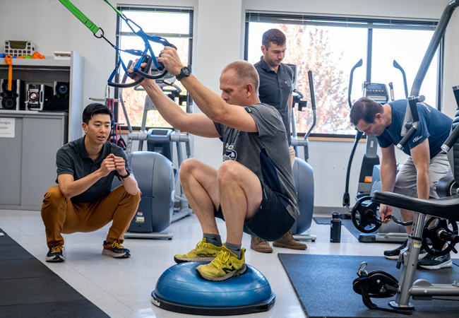 Students working with patients in the fitness clinic.