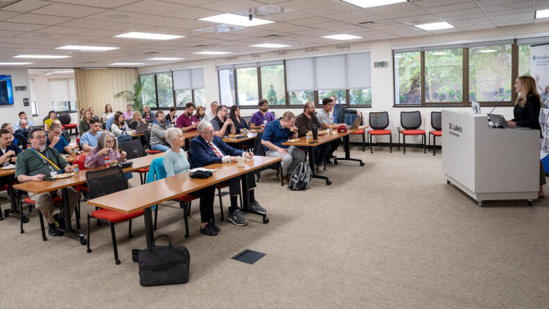 Room full of physicians and community members attending the Dr Joel DeLisa Lectureship.