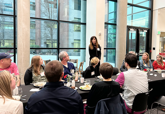 Dr Sabrina Paganoni speaking at a dinner.