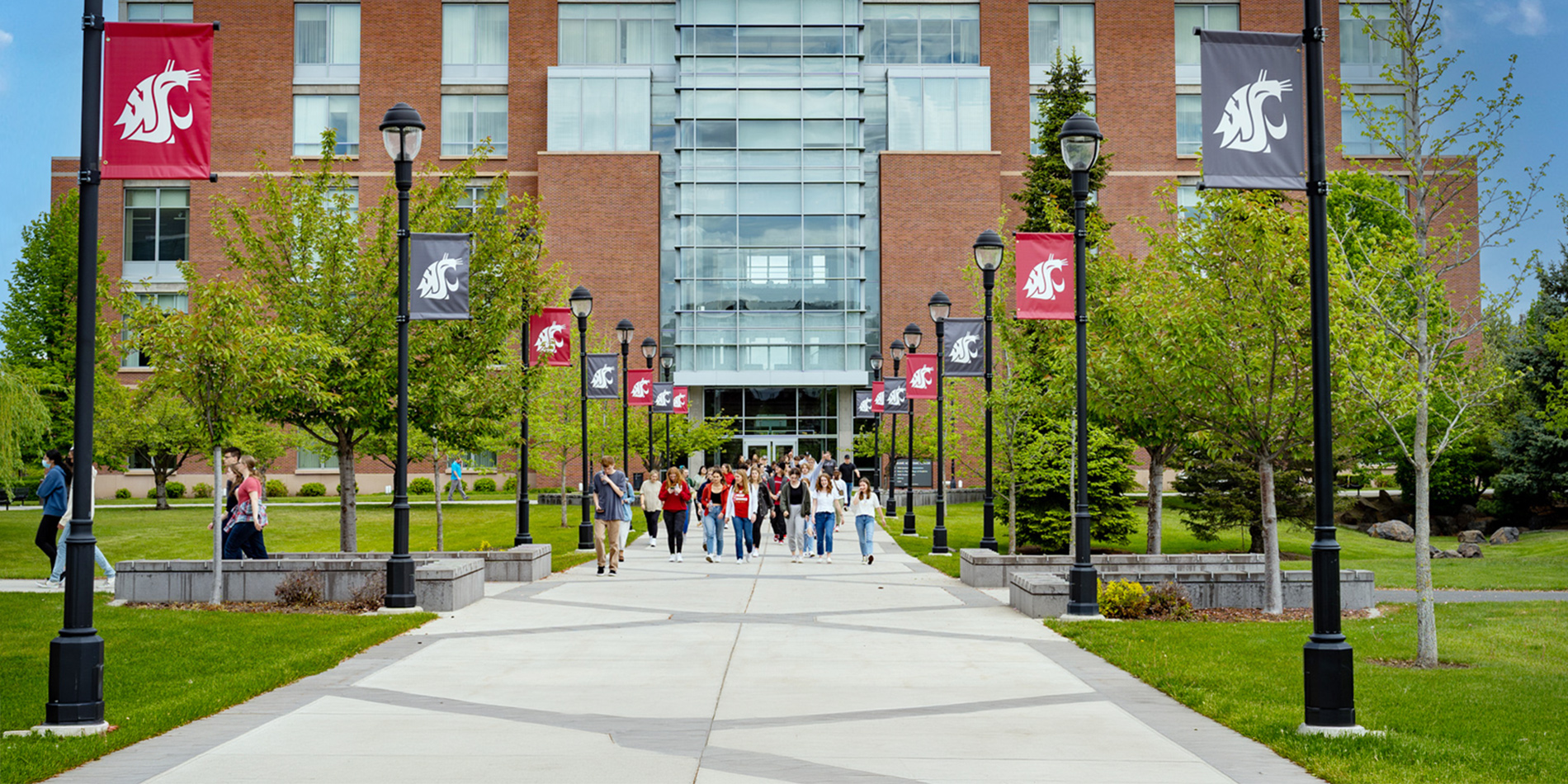 Students walking on the Spokane campus outside.