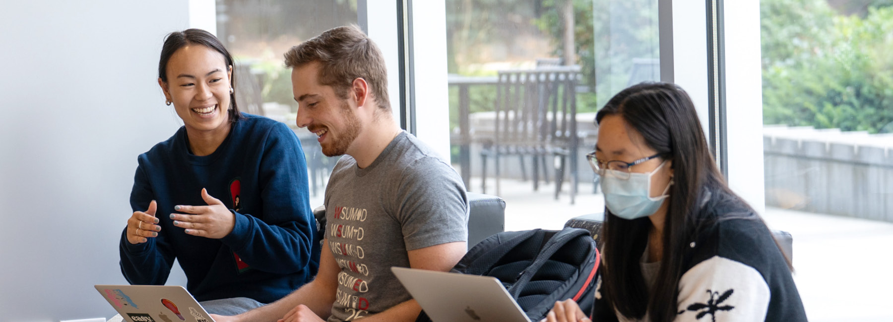 Students on Campus working on their laptops