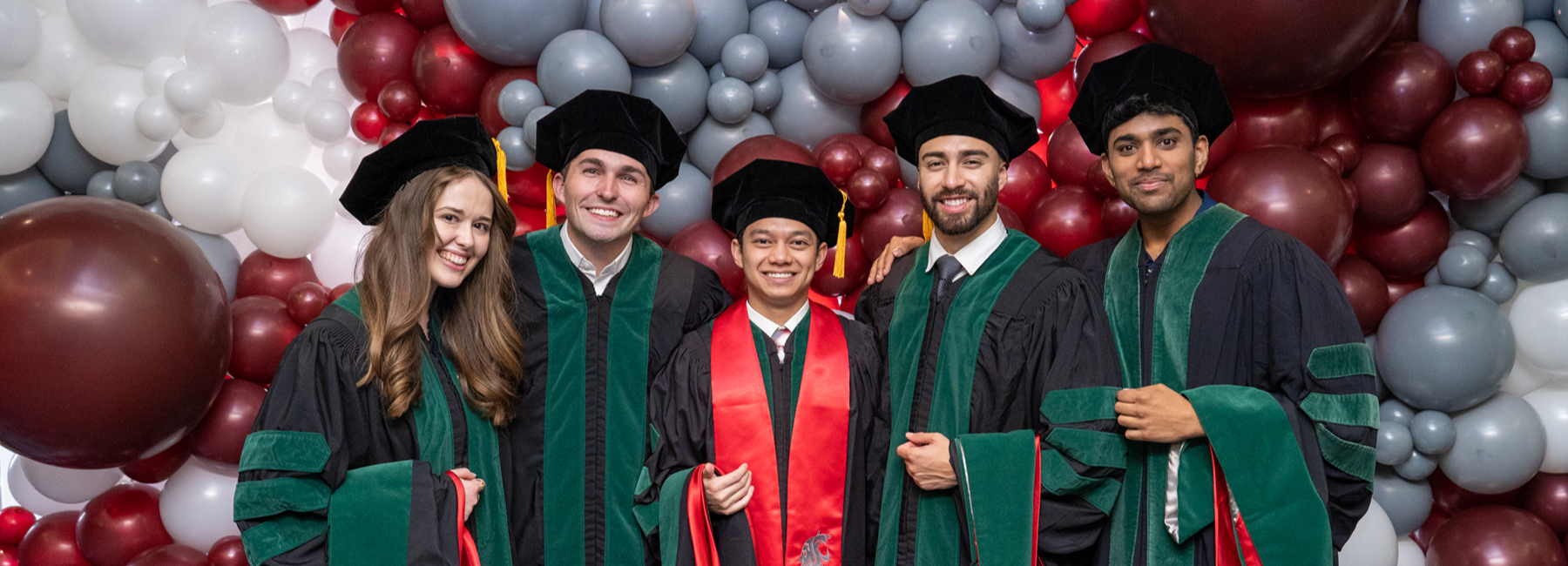 Five MD students in their Commencement gowns