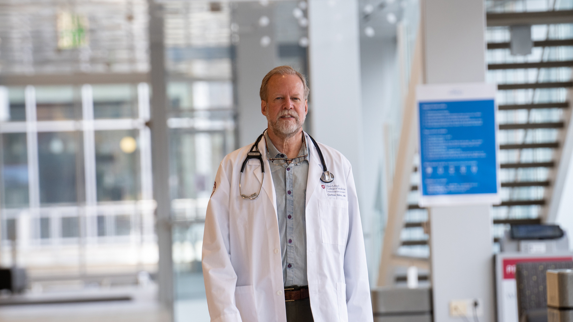 Doctor walking through a hallway.