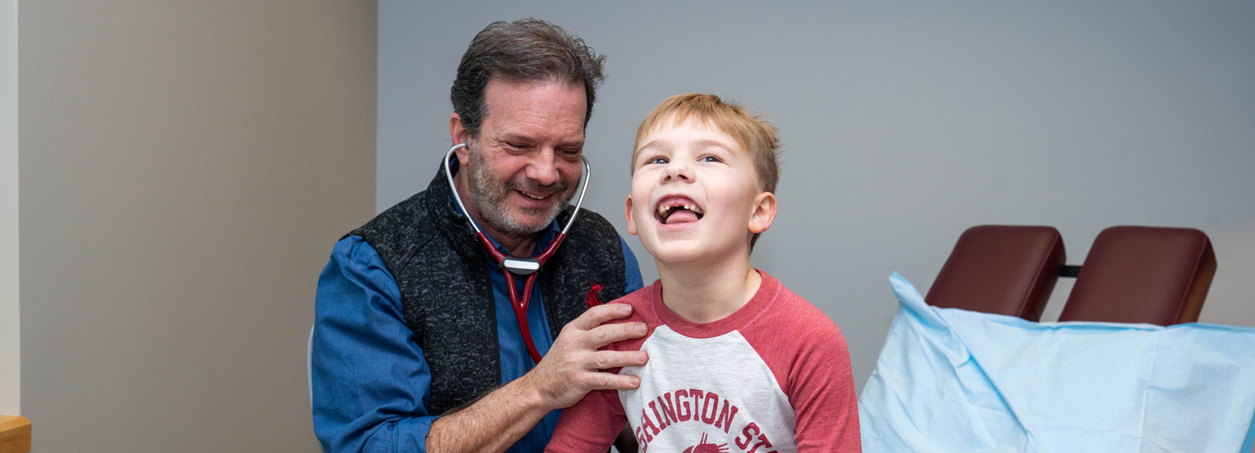Doctor listening to the lungs of a child.