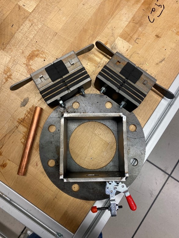 Components of a decontamination system laid out on a wooden table.