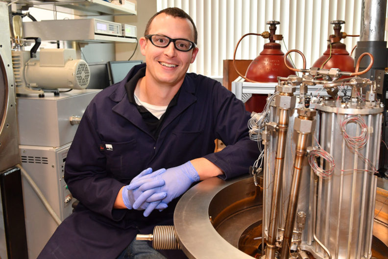 Jake Leachman sitting in the Engineering, Teaching, and Research Laboratory (ETRL Lab).