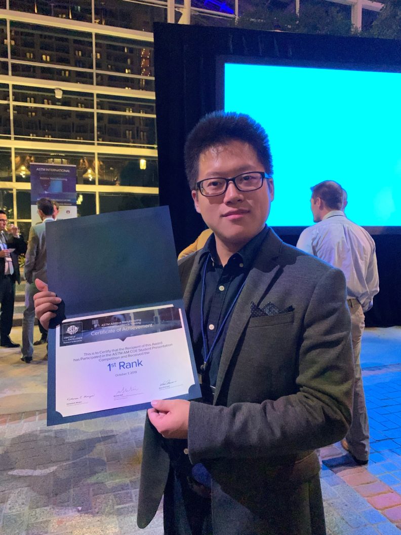 Yu-Chung Chang posing with his award.