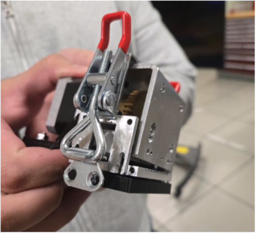 Hands holding a sharpening jig.