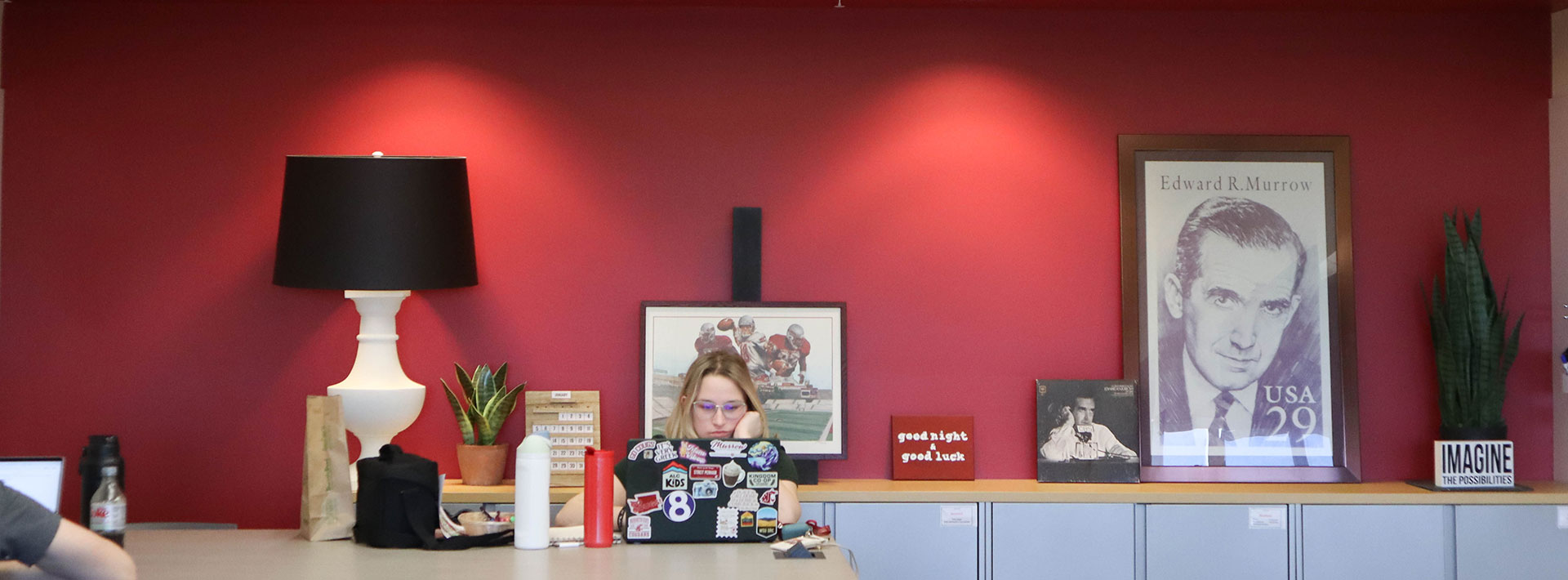 Student working on a laptop in the Murrow Center for Student Success