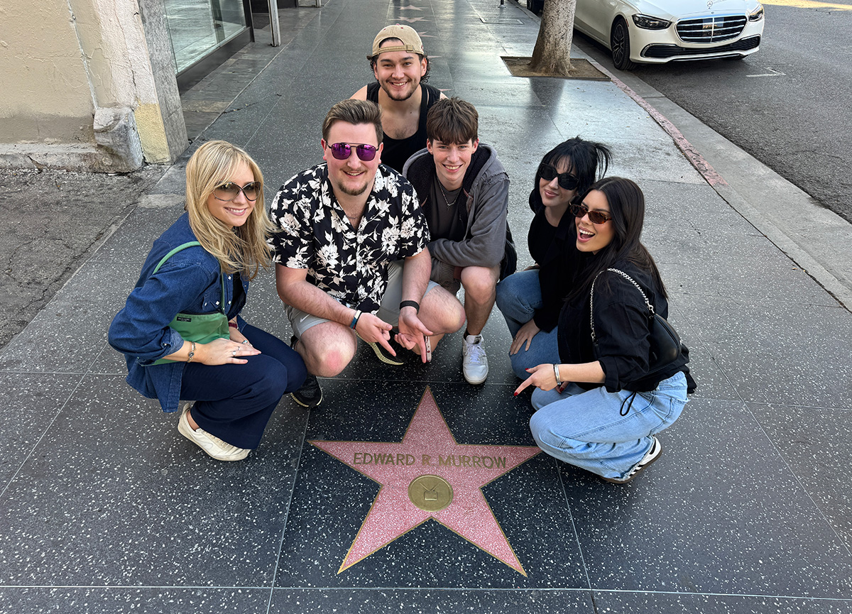 Students huddled around the Edward R. Murrow Hollywood star in Los Angeles, CA