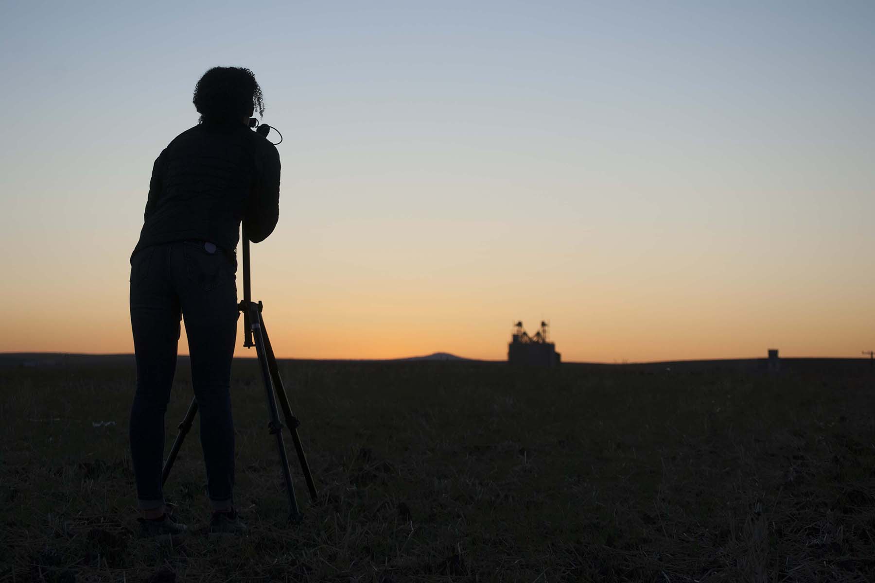 Photographer taking a picture of a sunset