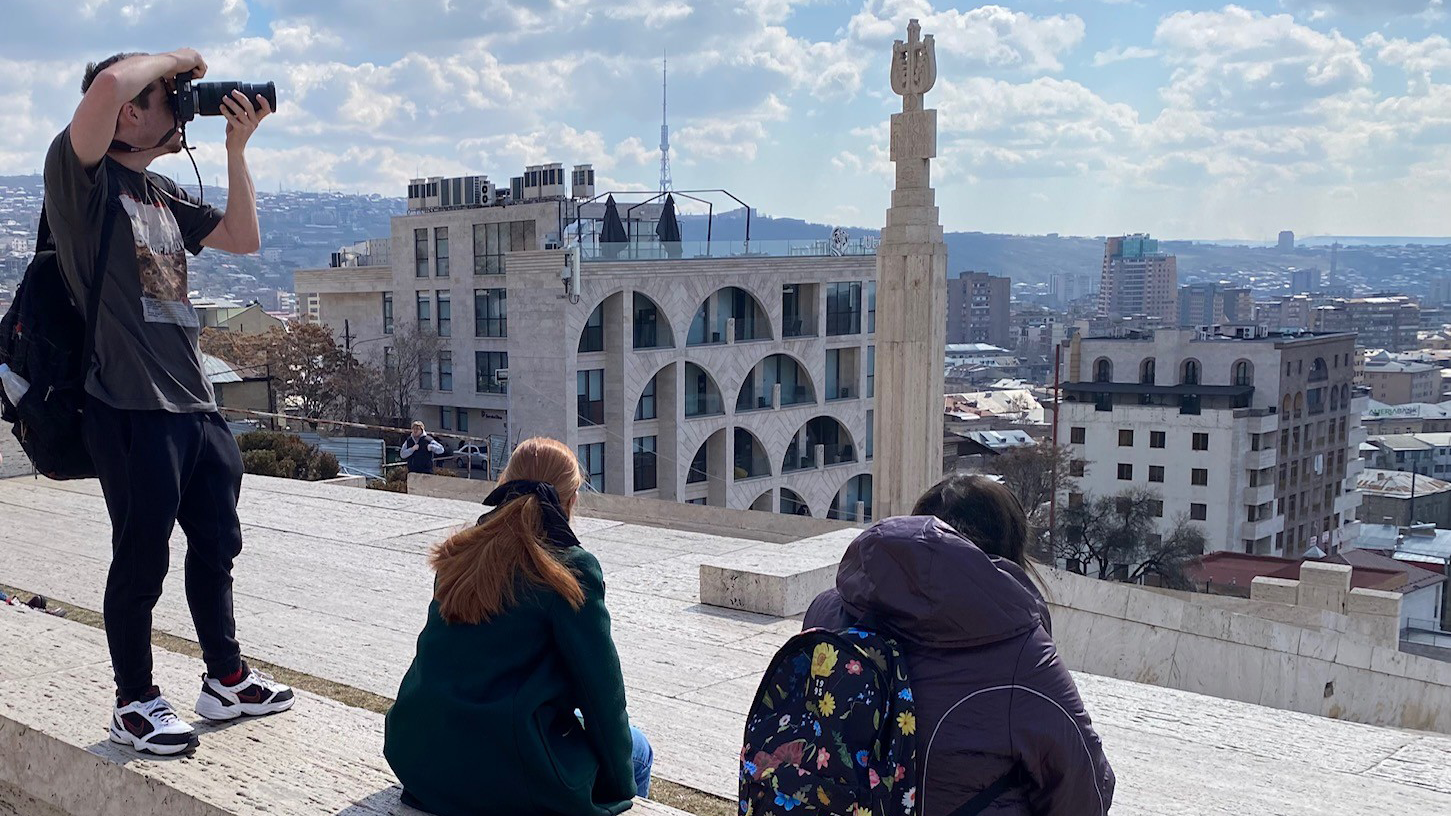 Cole Quinn (2024 grad) shoots a photo from the top of the Cascade Complex in Yerevan, Armenia, in March 2024