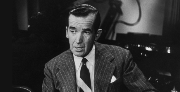Black and white image of Edward R. Murrow sitting in a TV studio