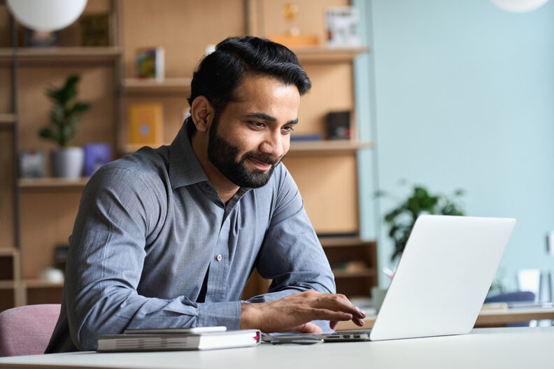 man studying on a laptop