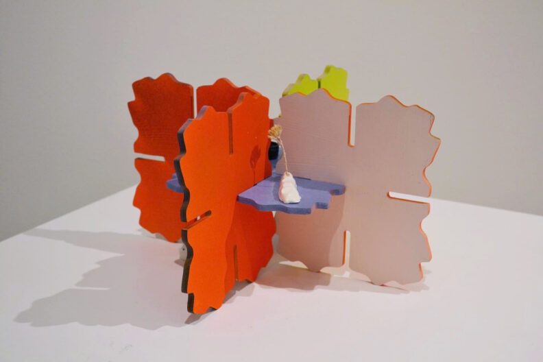 colorful artwork by artist Krista Brand on a white pedestal