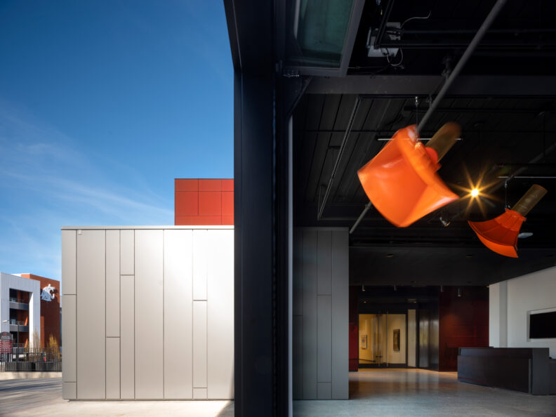 orange horns suspended from the ceiling of an art gallery at the top of the WSU college campus