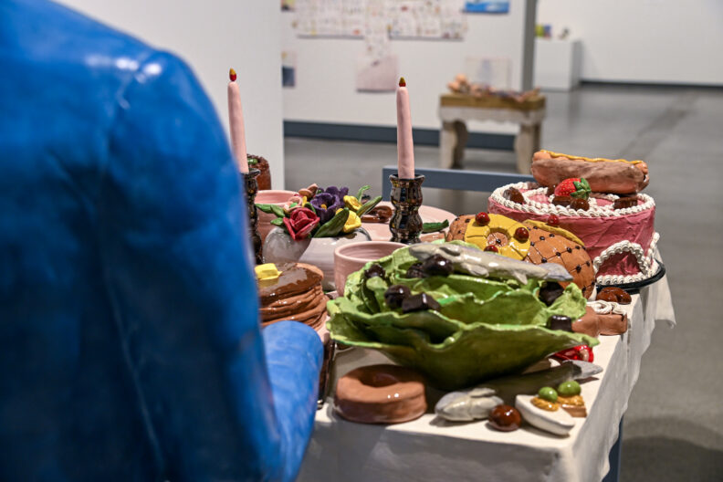 Image of Marilyn Lysohir’s ceramic food art in the museum gallery