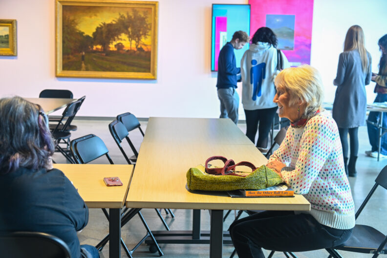Image of tables with participants waiting to make love letter zines