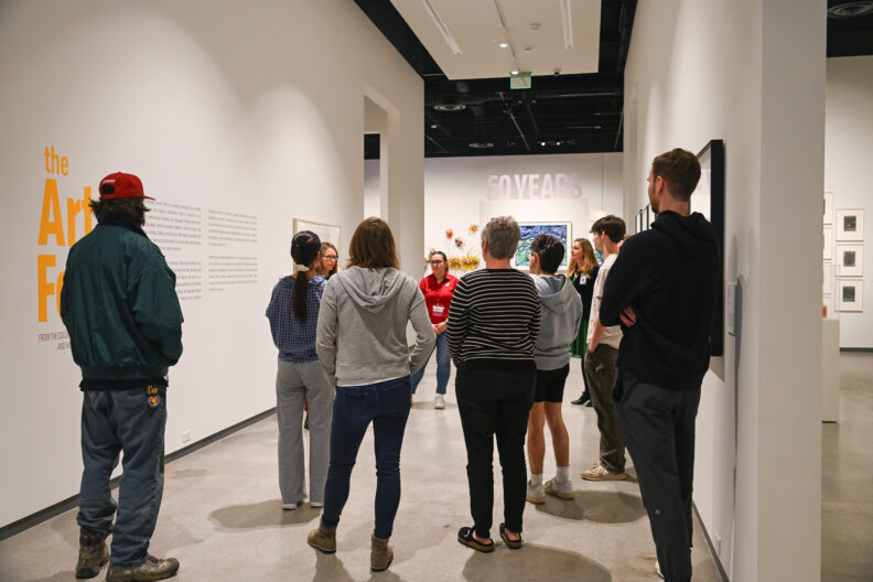 image of visitors to the museum taking a tour of the exhibitions