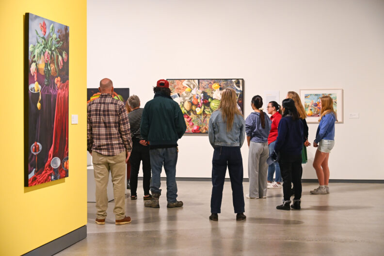 image of visitors to the museum taking a tour of the exhibitions