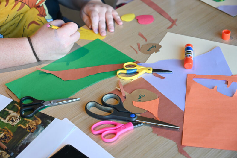 Image of workshop participants making collages in the museum