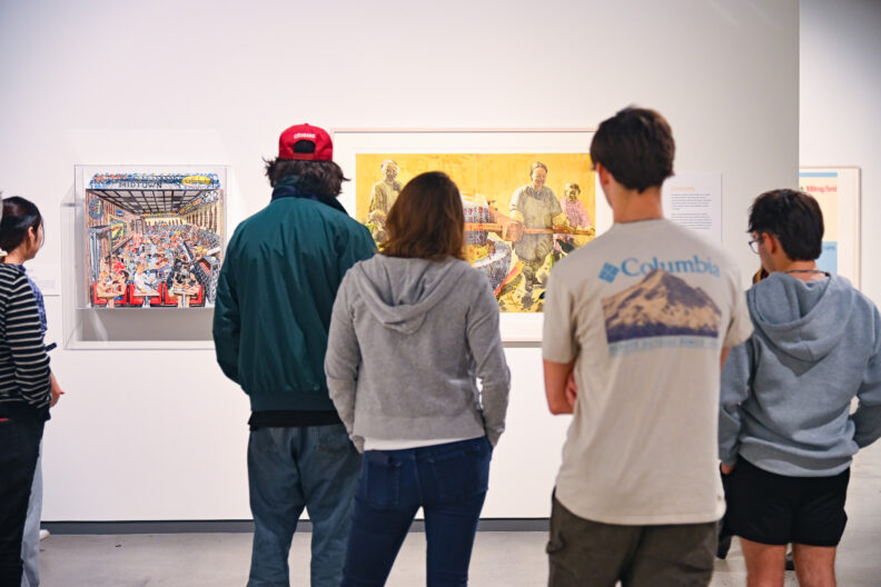 image of visitors to the museum taking a tour of the exhibitions