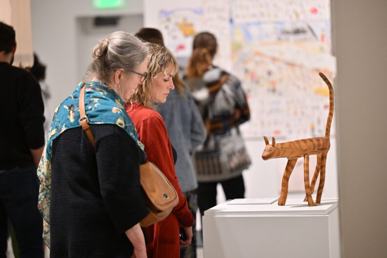 Image of museum visitors enjoying the Faculty Remix Exhibition Reception on 01/16/25